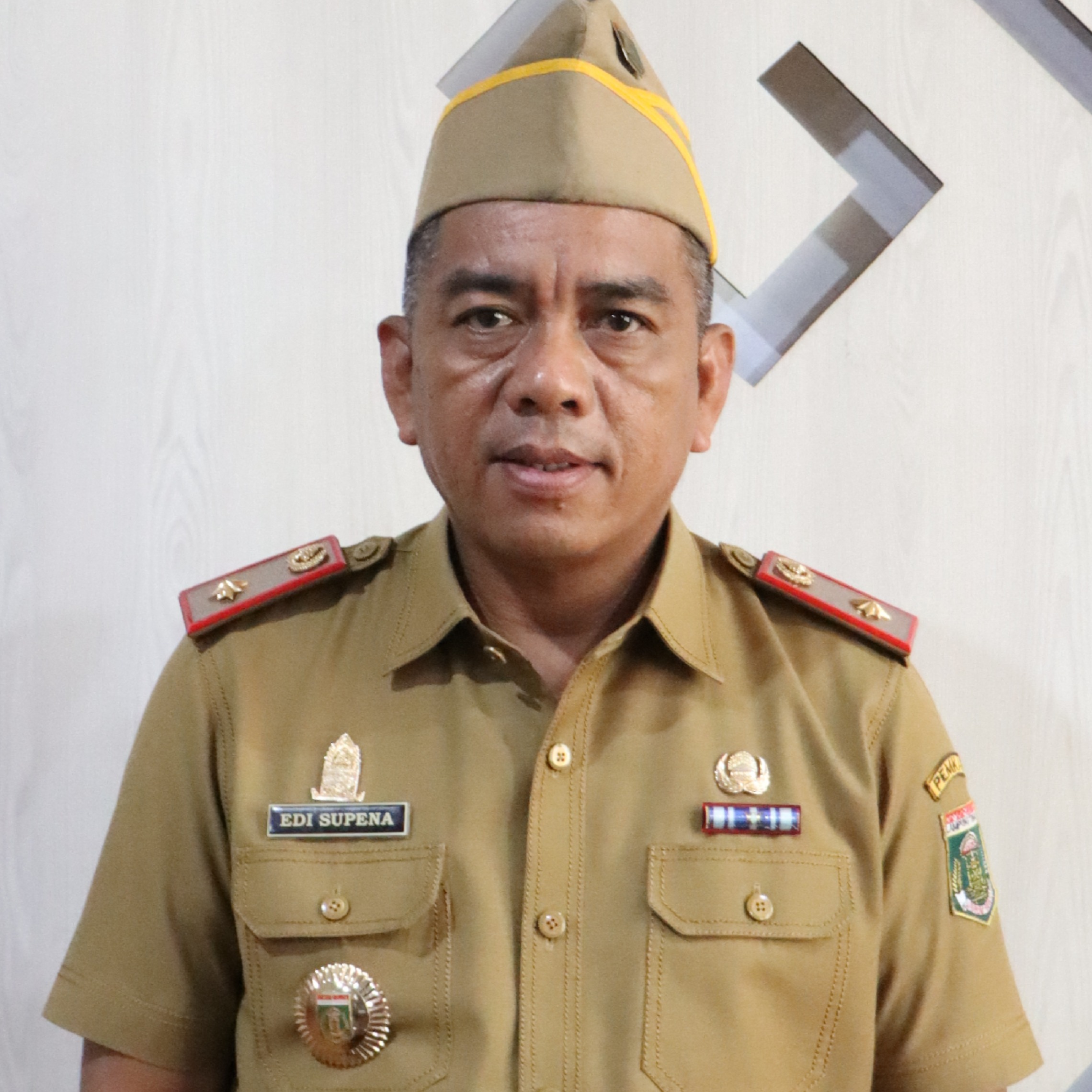 EDI SUPENA, S.Sos., M.M. 